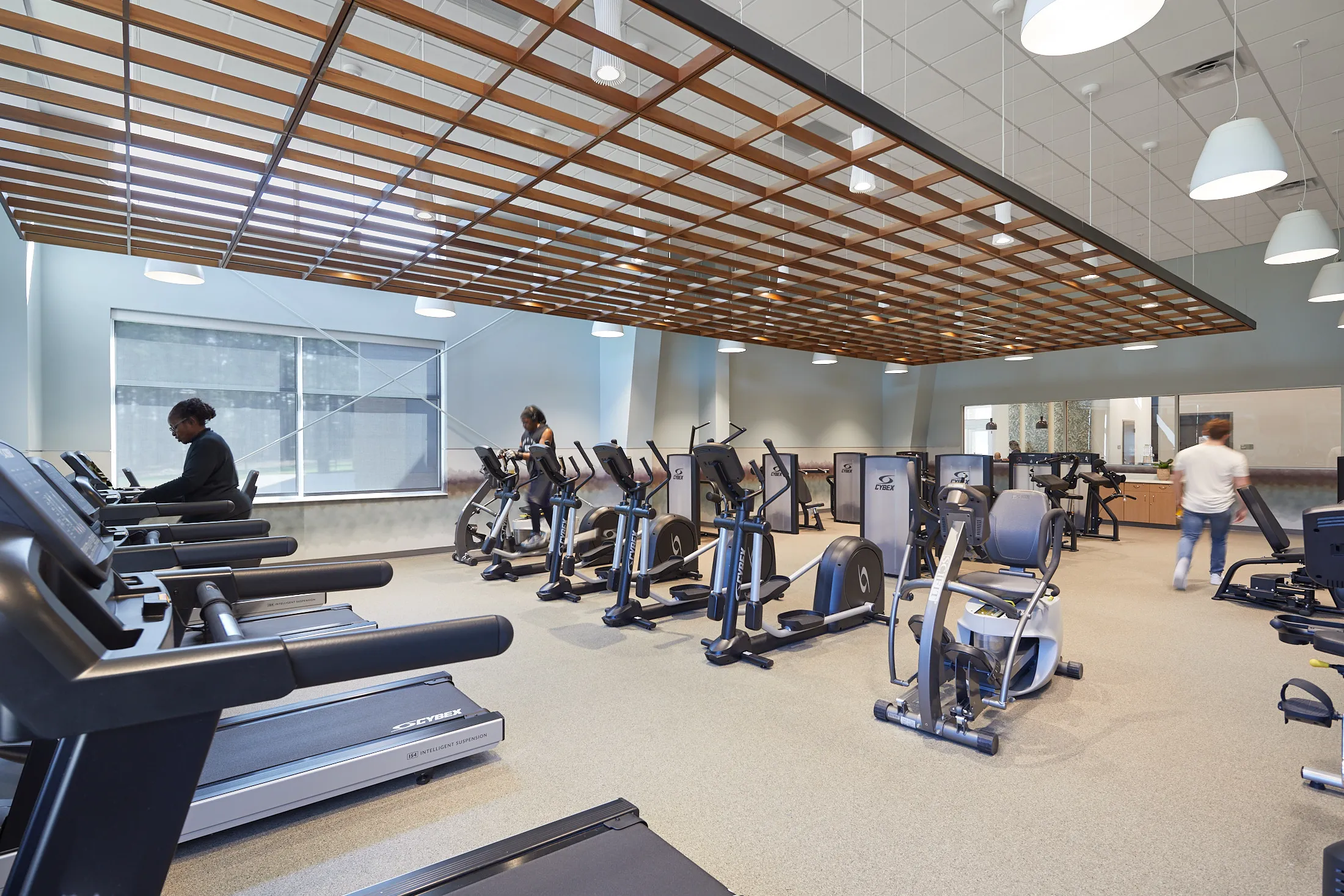 An exercise room with treadmills and elipticals at the Bill Crisp Senior Center by HH Architecture