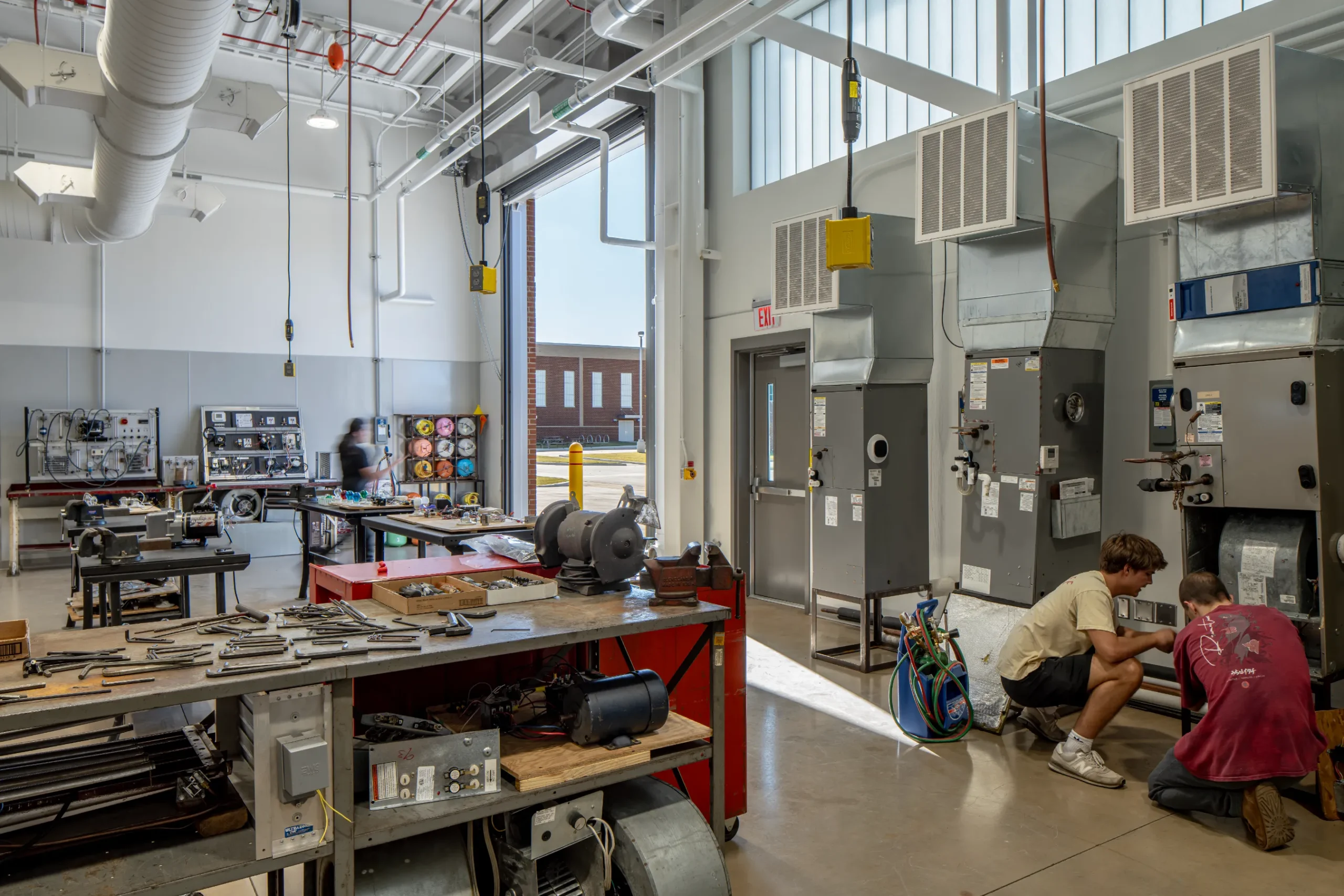 Large garage space inside of the Wilson CC's Building S by HH Architecture